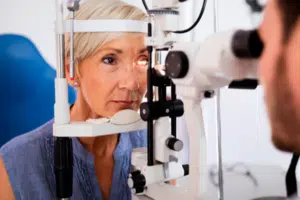 Photo of a woman having her eyes examined.
